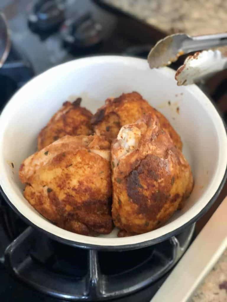 browned chicken thighs in bowl