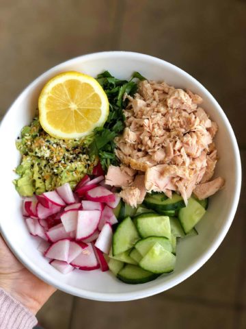 bowl of canned tuna, avocado, cucumber, radish and lemon