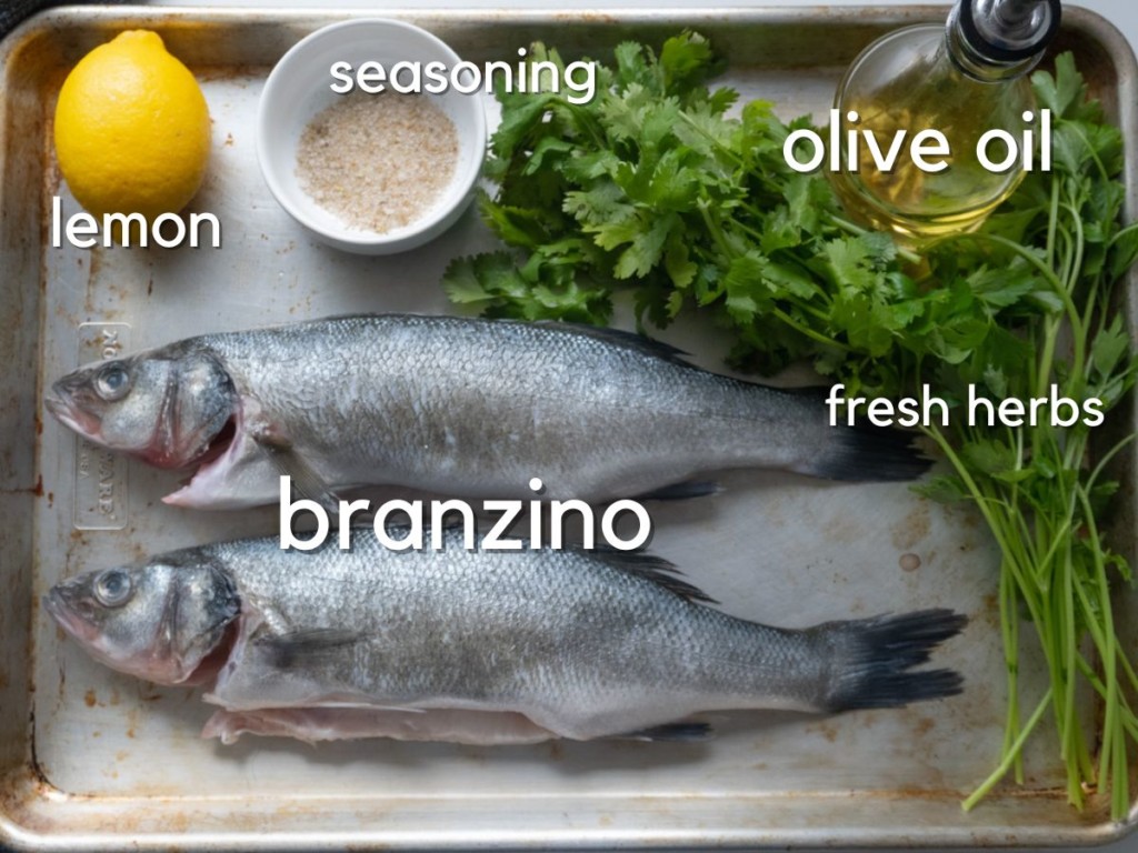 ingredients on a sheet pan for roasting a whole fish