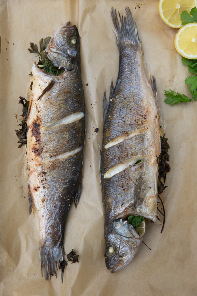 cooked branzino on parchment paper