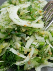 close up of shaved fennel, stalks and fronds, mixed with sesame seeds