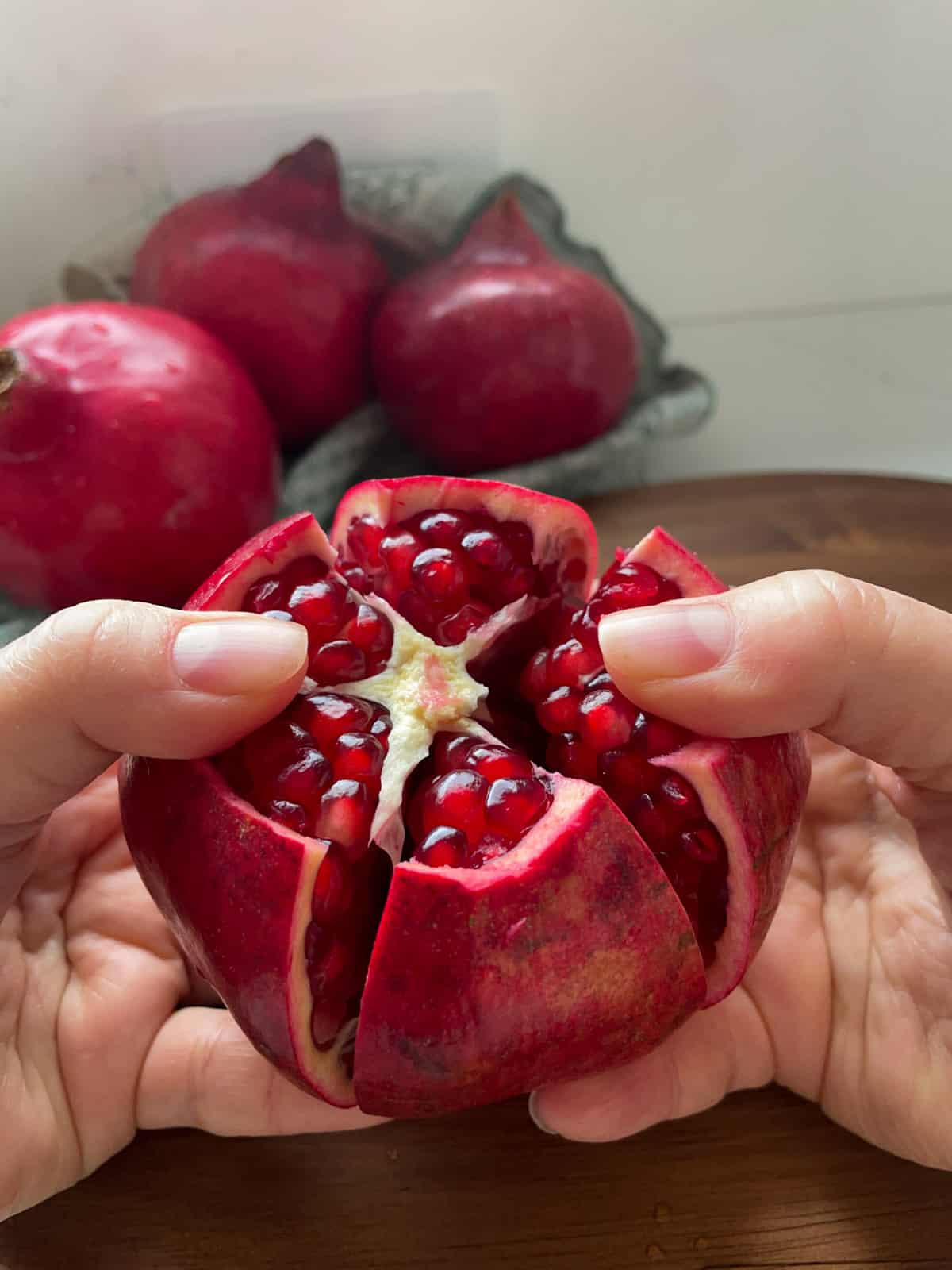 Pulling the segments of a pomegranate apart.