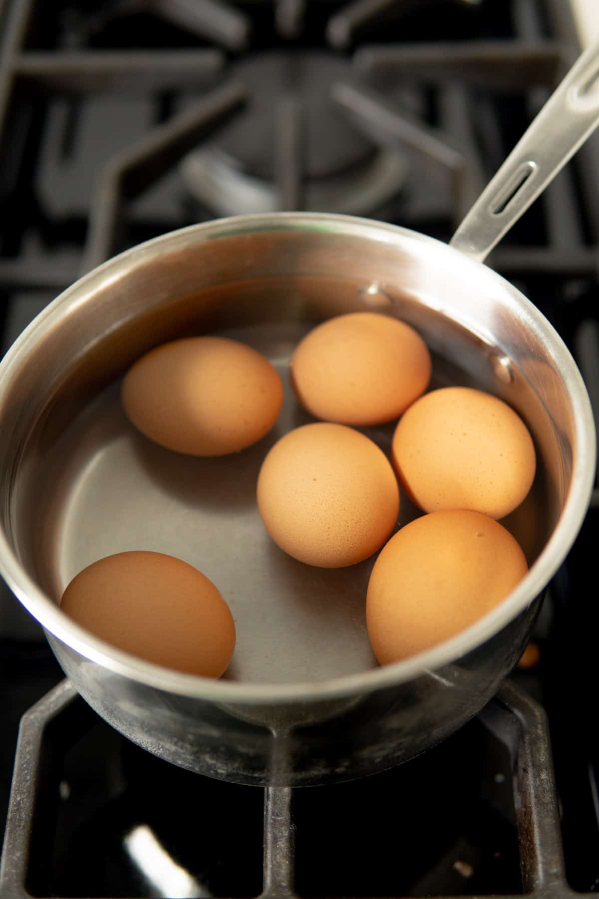 Eggs in a pot covered with water.