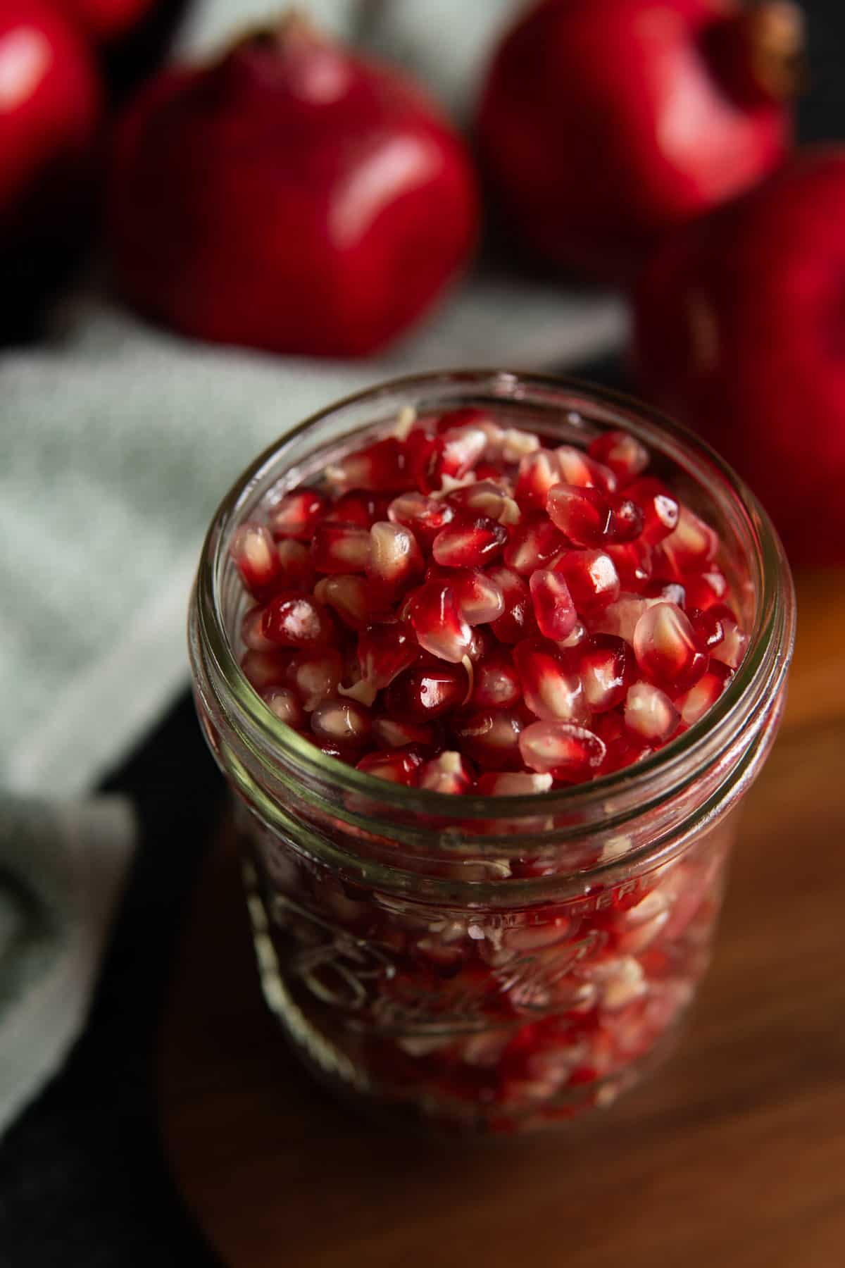 Pomegranate seeds in a jar.