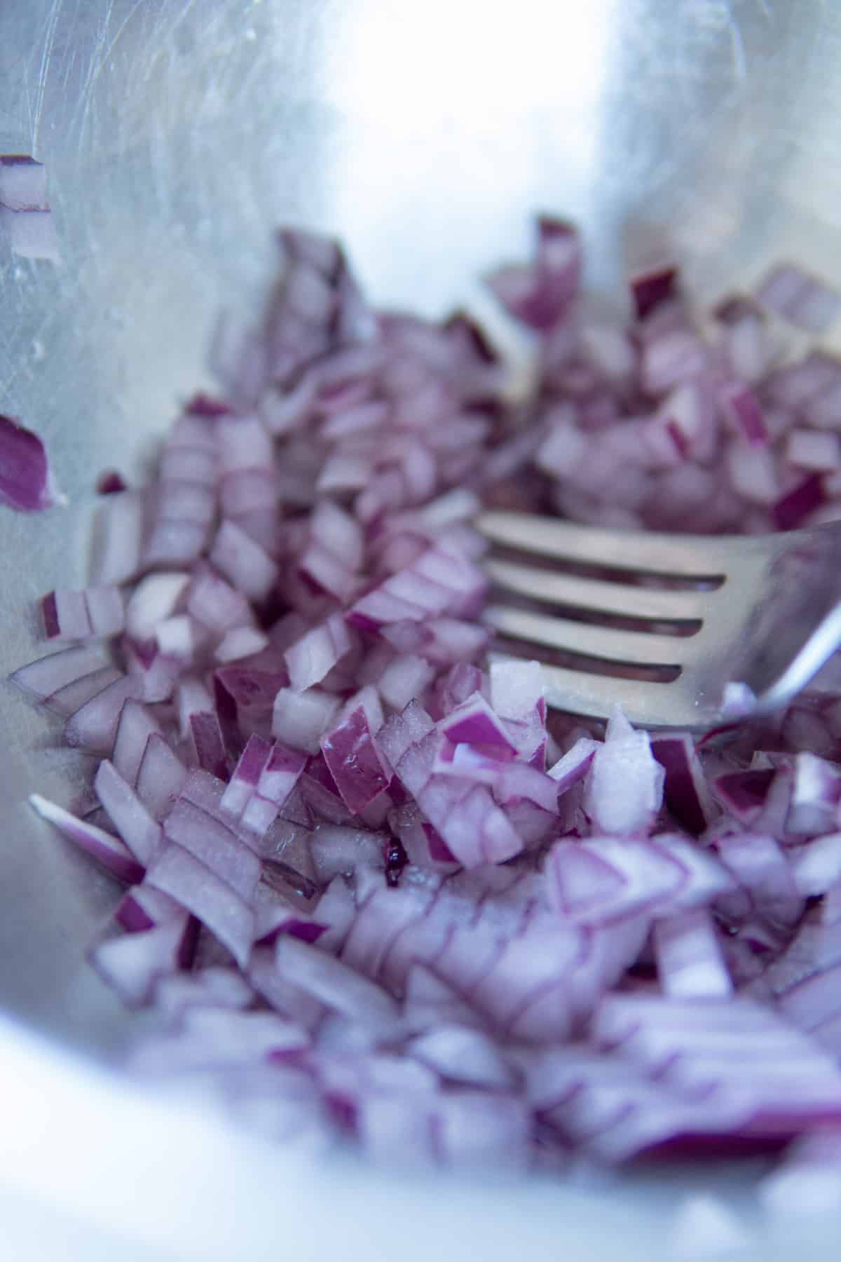 Diced red onions with lemon juice.