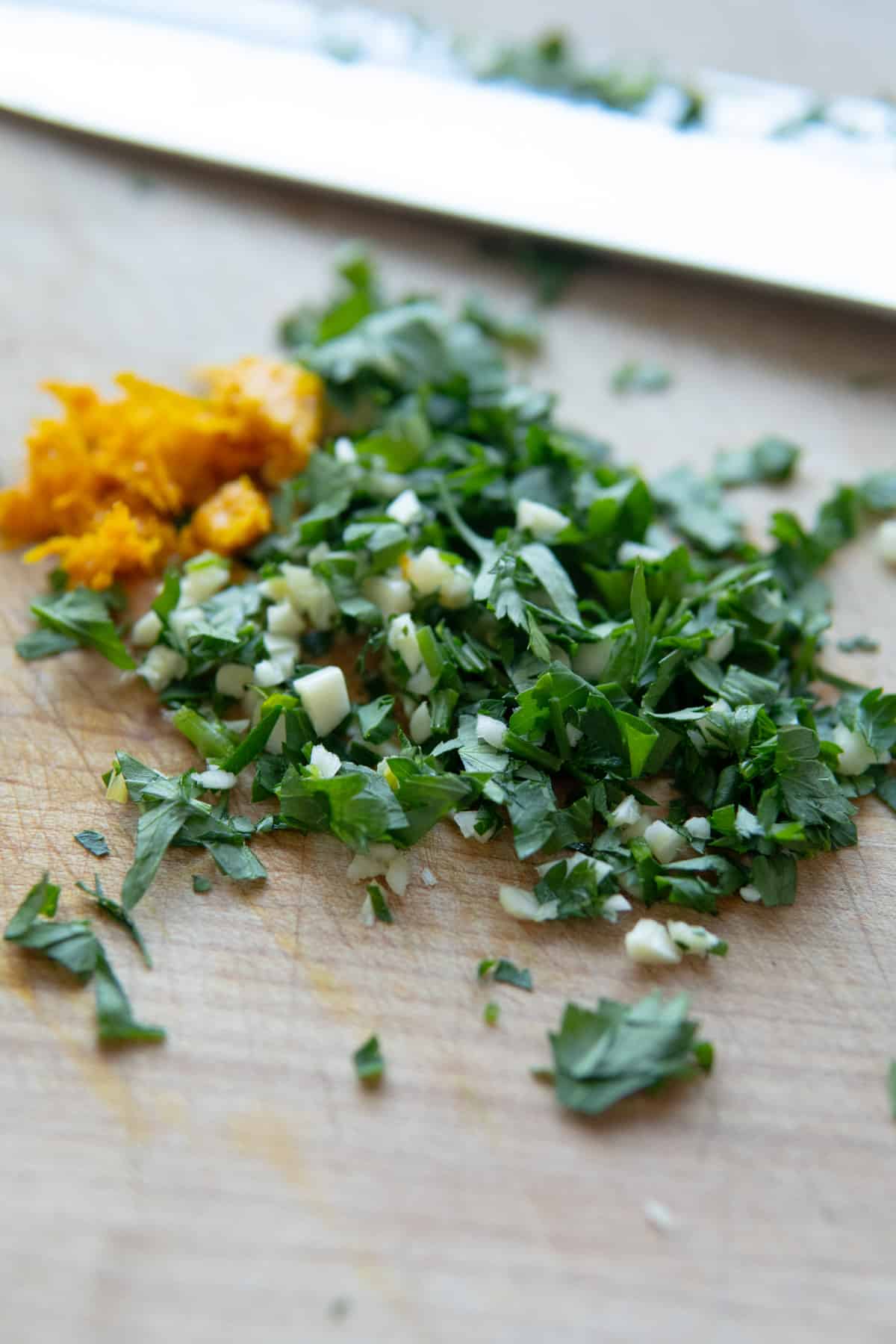 chopped up gremolata mixture of orange zest, garlic and parsley. 