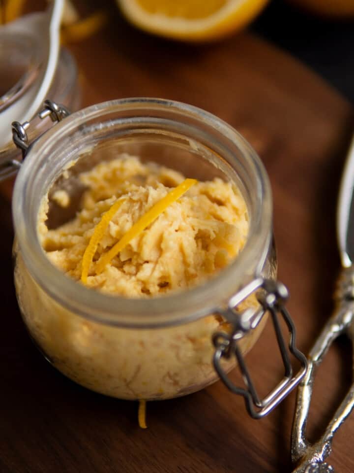 miso butter in glass jar with orange zest and butter knife