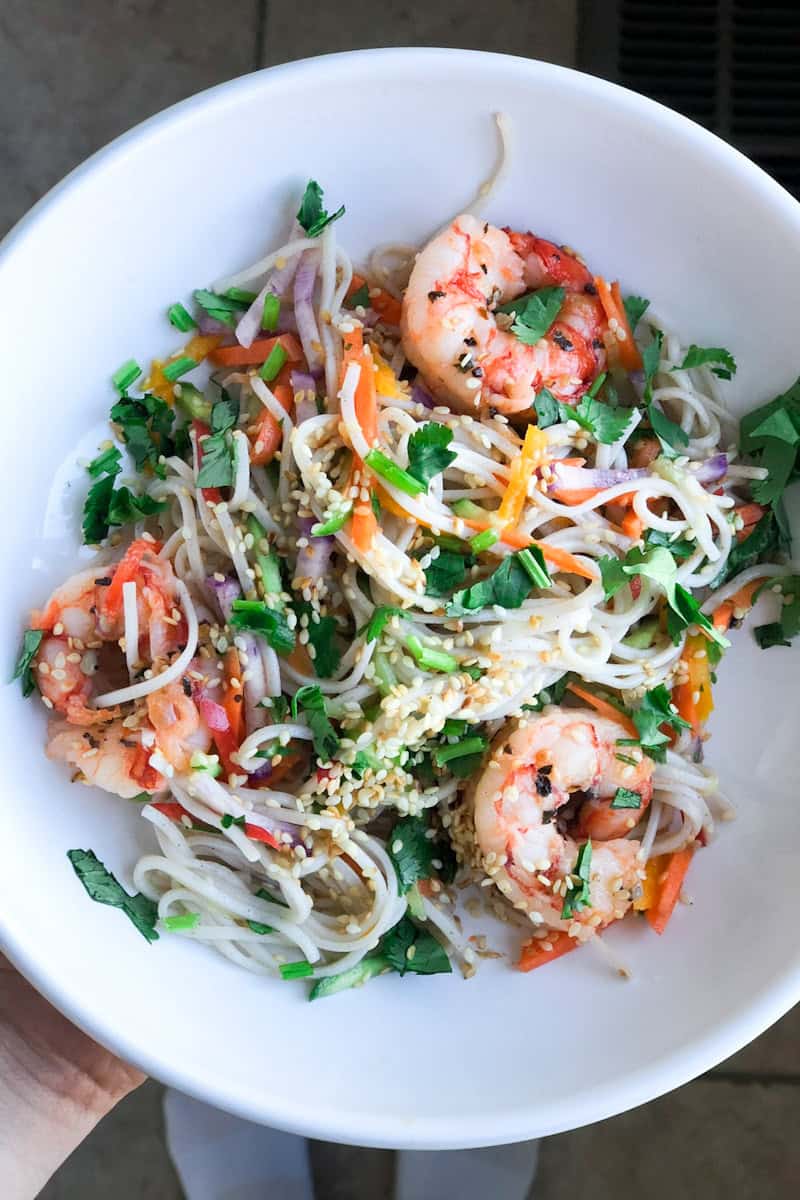 bowl with noodles, shrimp, cilantro, carrots