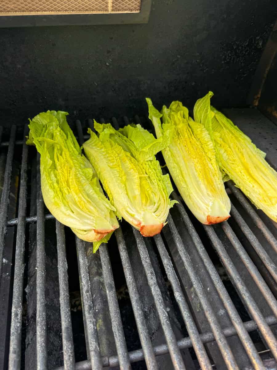 romaine lettuce halves on a grill