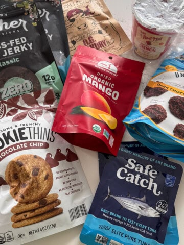 packaged airplane snacks on kitchen counter.