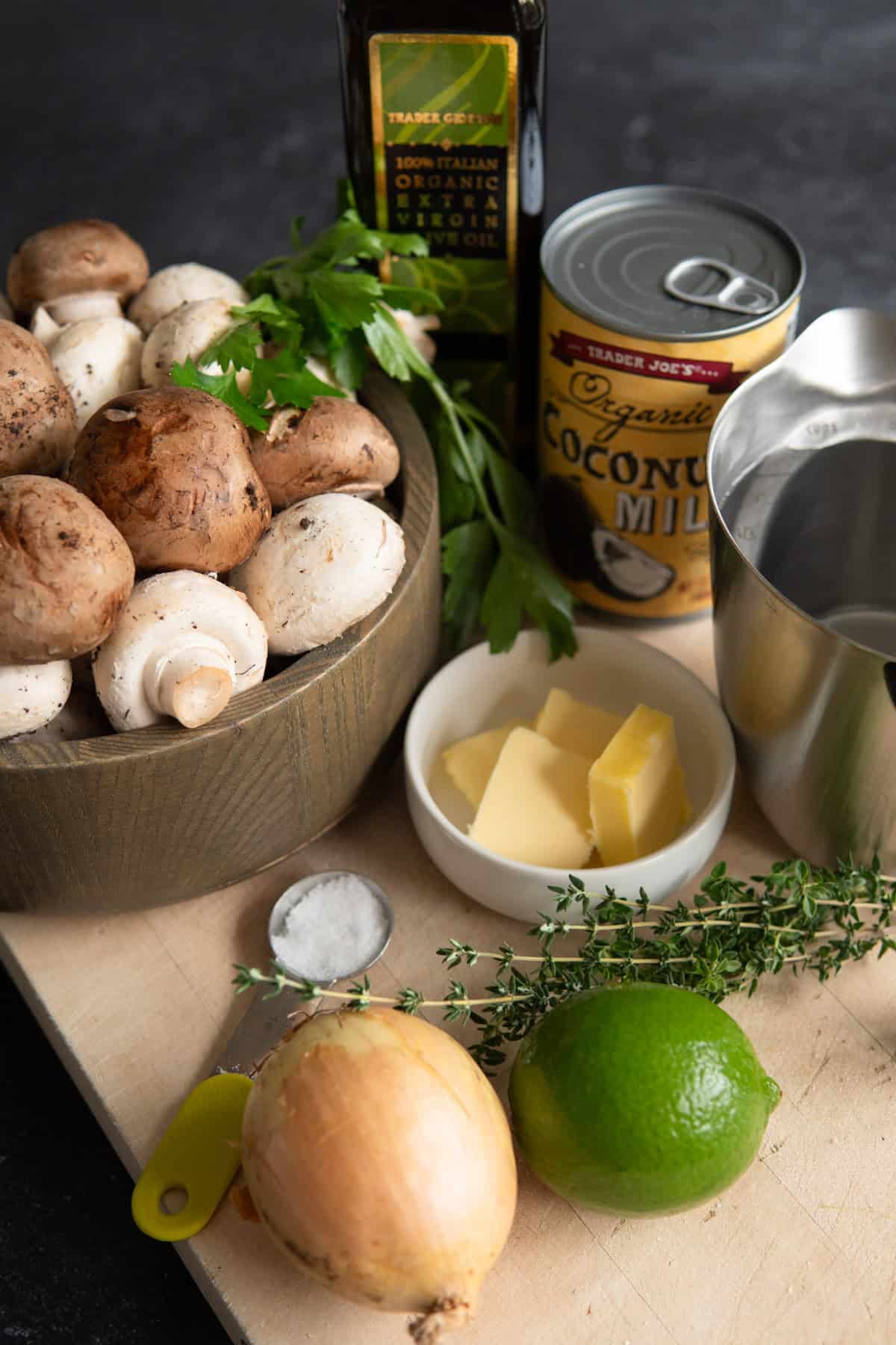 ingredients for soup on a wooden board. mushrooms in bowl. 