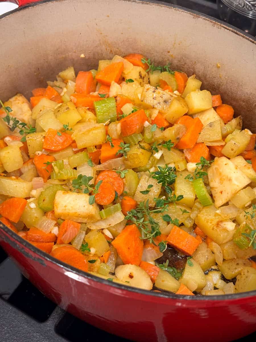 dutch oven with vegetables and thyme