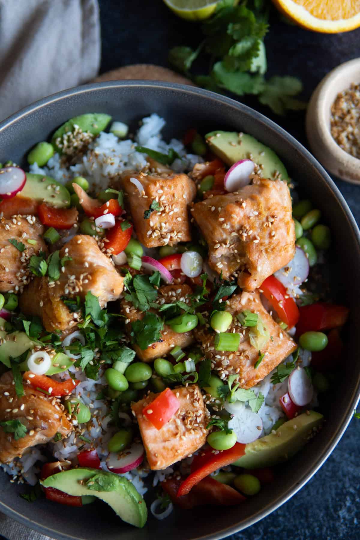 ready to serve bowl with salmon pieces, rice and edamame