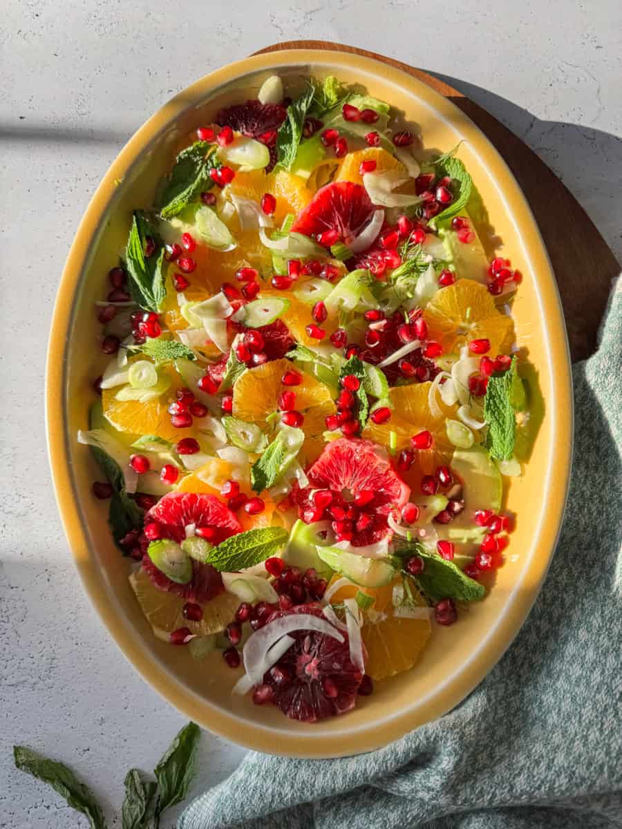 oval platter with citrus salad and some sunshine shining thru 