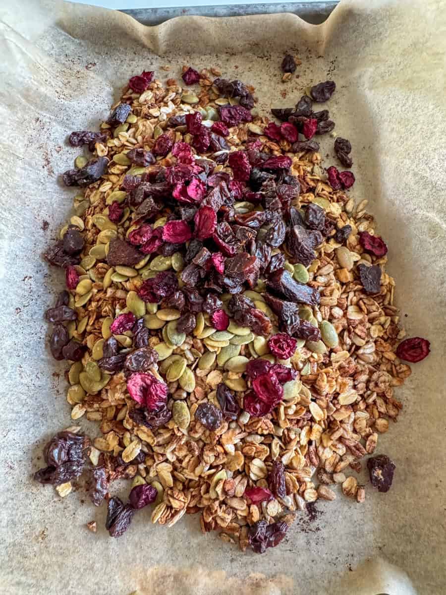 baked granola with pumpkin seeds, raisins, and cranberries. 