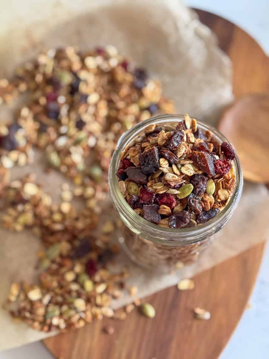 jar of granola on a board. 
