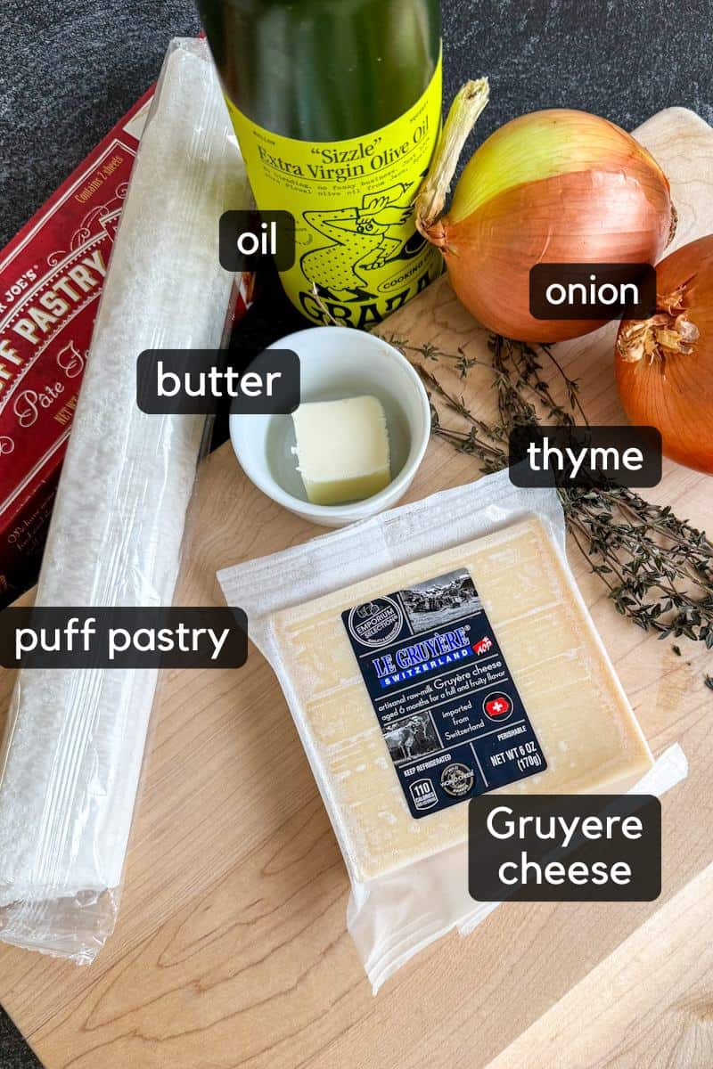 ingredients for making french onion tart on board.