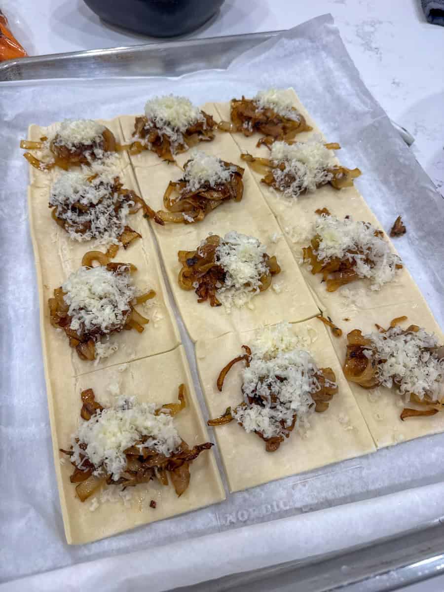 cut up puff pastry squares with onion and cheese filling